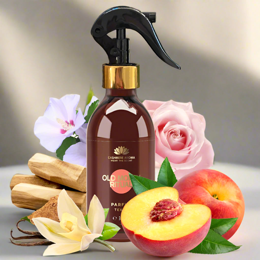 Brown spray bottle with floral and fruit elements on a light background
