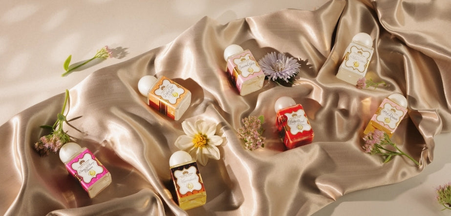 30 ml Mini Laundry Perfume bottles arranged with flowers on champagne satin